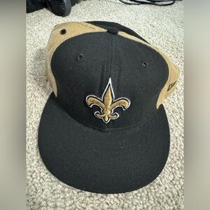 New Orleans Saints Hat. Black and Tan Cap with Fleur-de-lis Logo